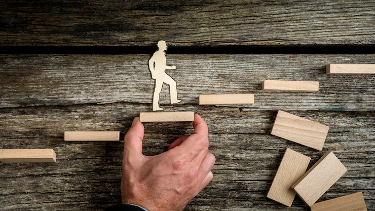 Visual of a person standing at a crossroads with signs labeled “Data Privacy,” “Bias,” “Complexity,” and “Cost,” representing challenges in building AI agents.