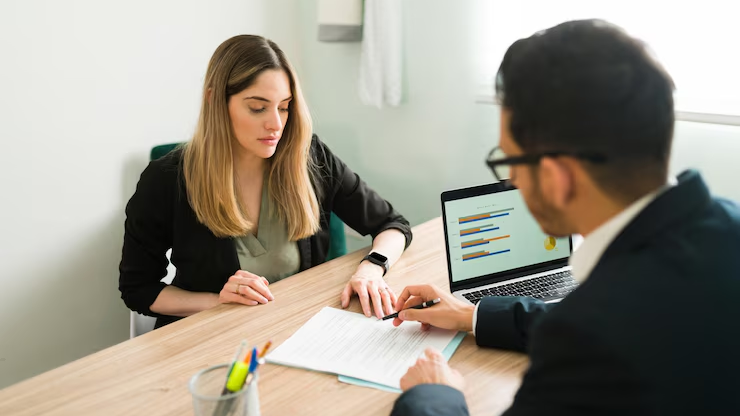 Human insurance agent working alongside AI tools in a digital workspace